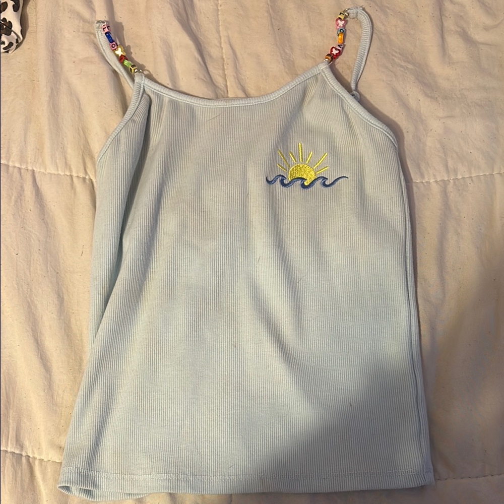 btween Light Blue Tank Top with Sun and Wave Design